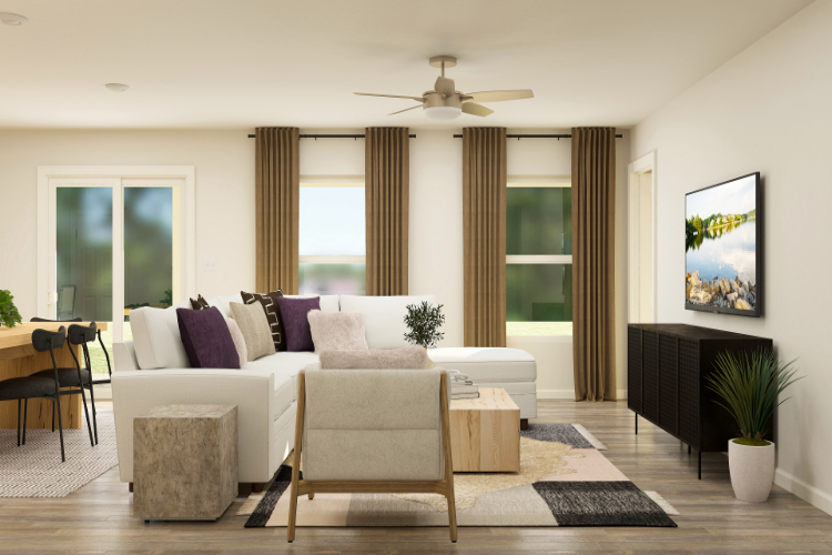 A living room with a fireplace and a large window.