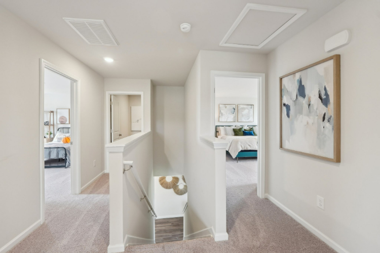 A room with a bed and a desk.