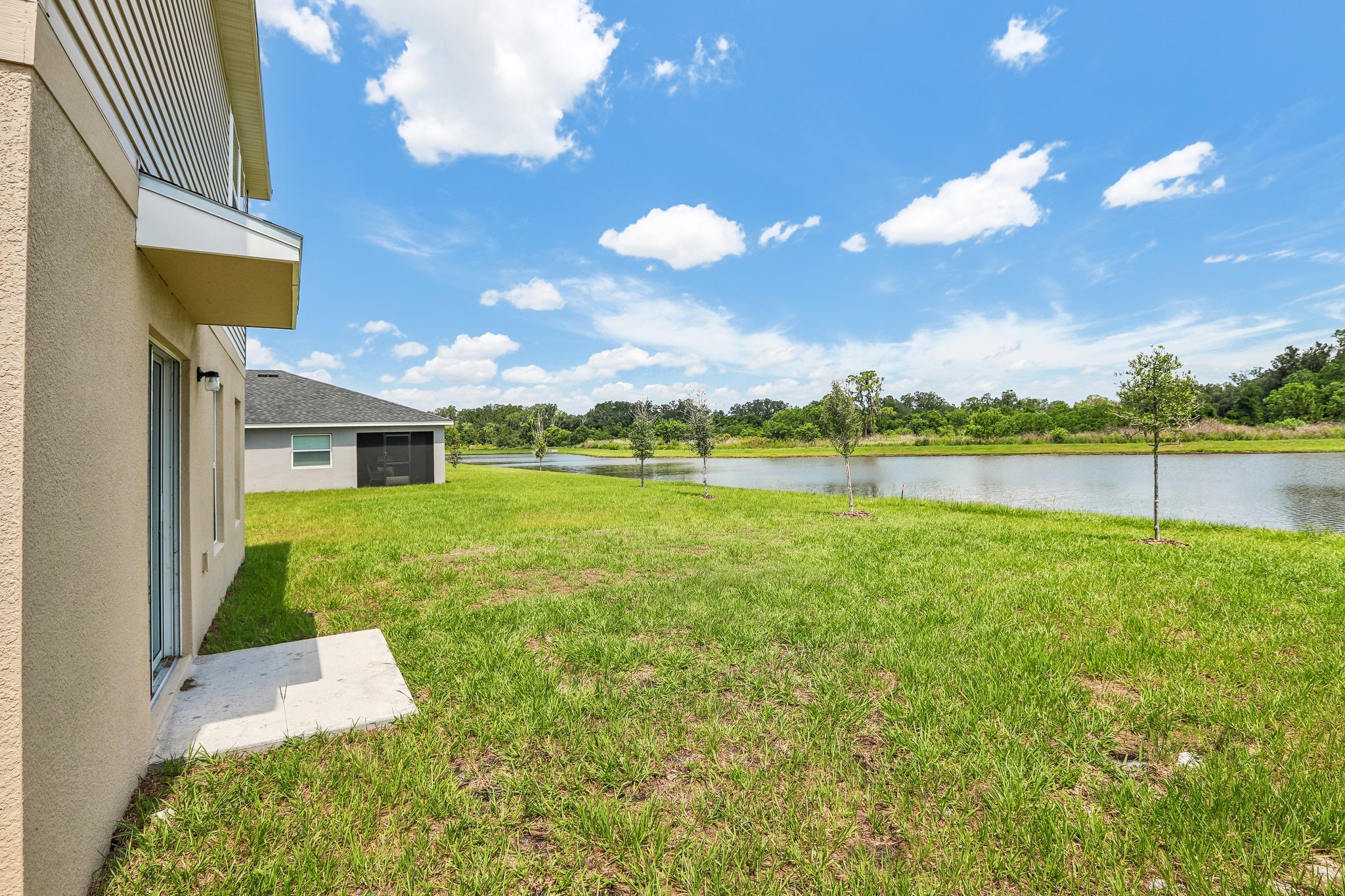 A house next to a pond.