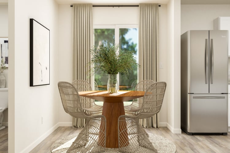 A dining room table with chairs.