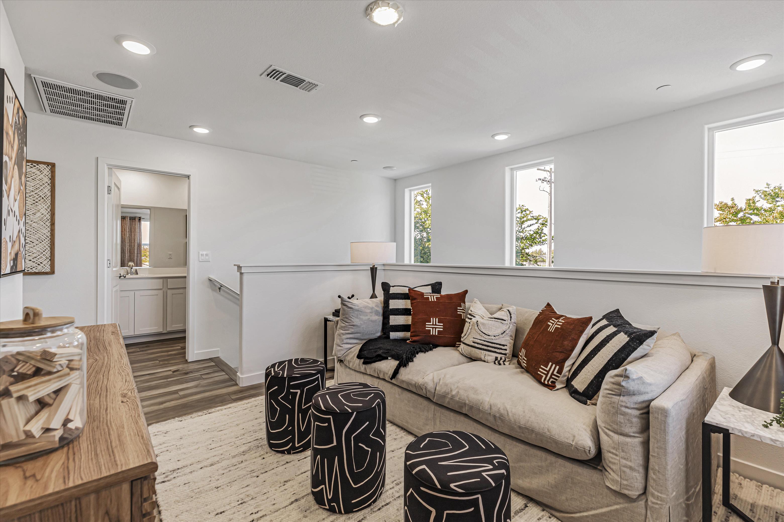 A living room with a couch and a table.